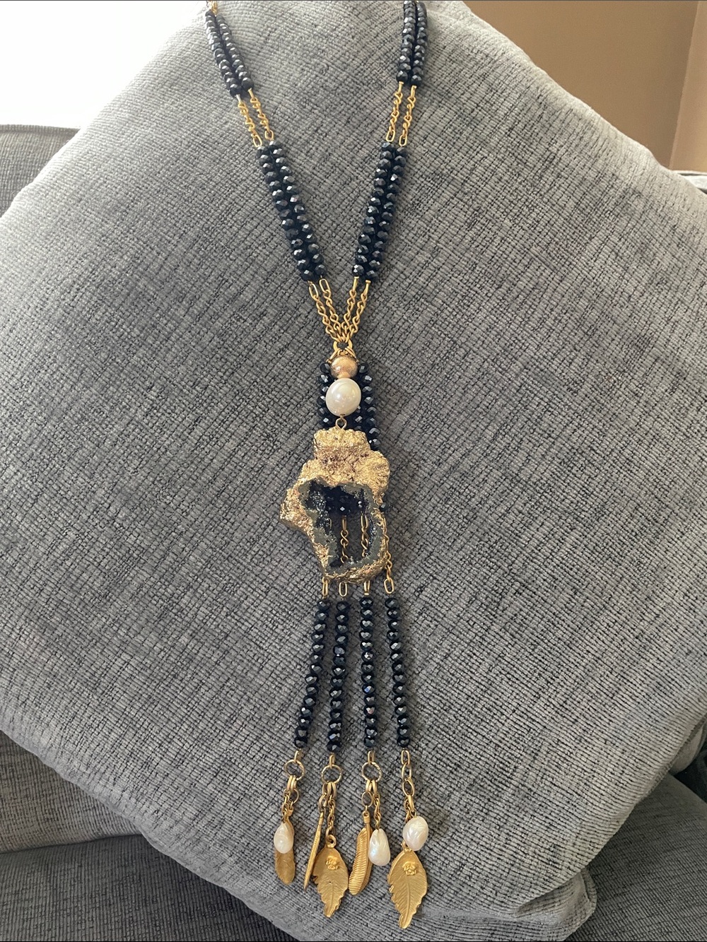 Vintage handcrafted gold and dark navy beaded necklace with leaf pendants